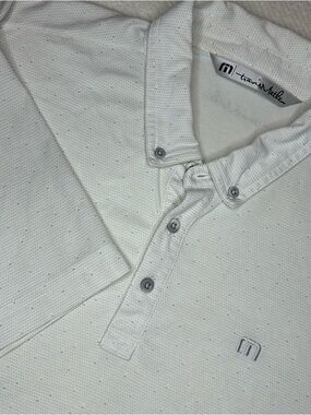 Travis Mathew Cream Polo with Subtle Dot Texture